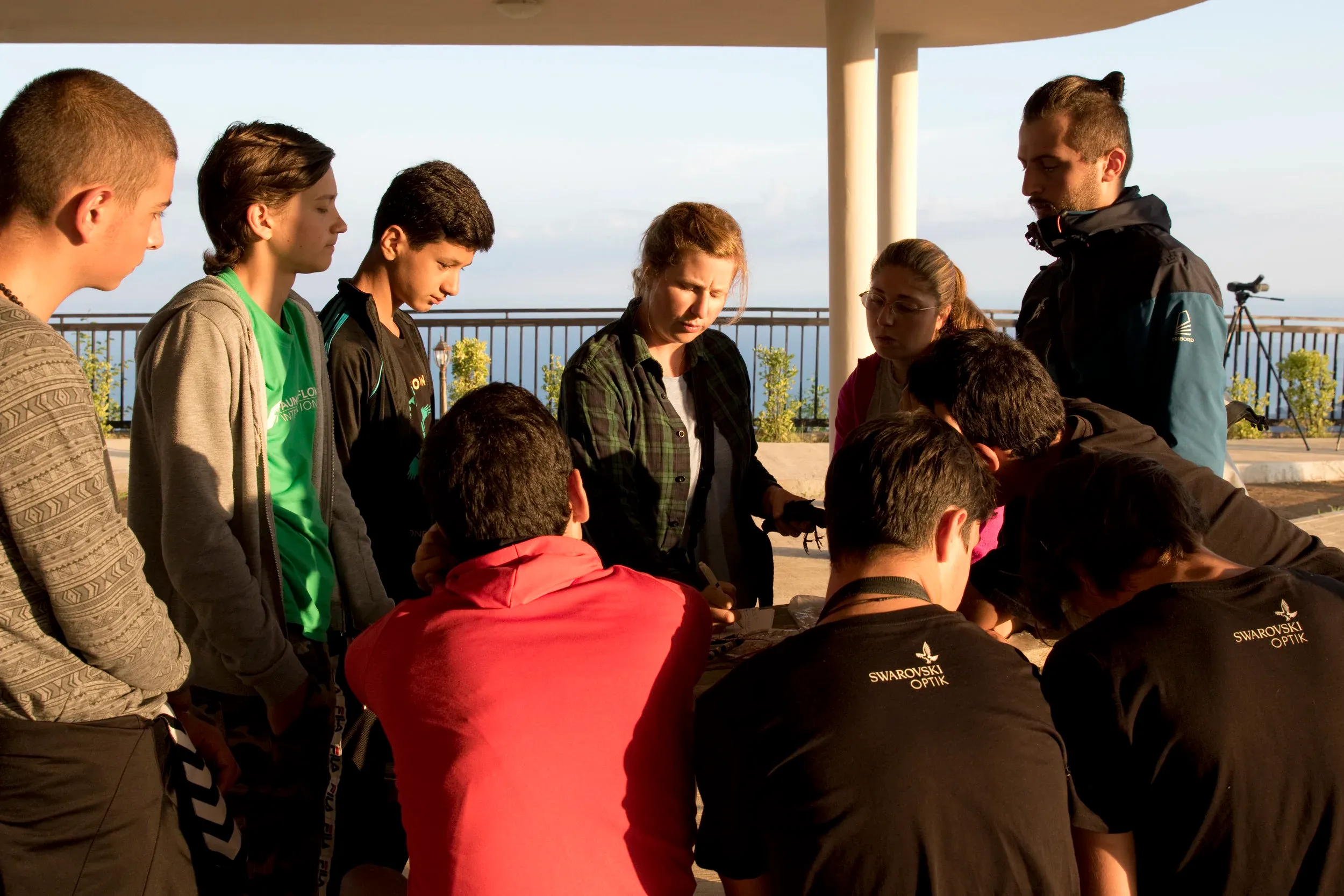 Educational activities at the new observation platform: Pia explaining about the importance of taking measurements when catching a bird to local young falconers. Photo: Triin Kaasiku.