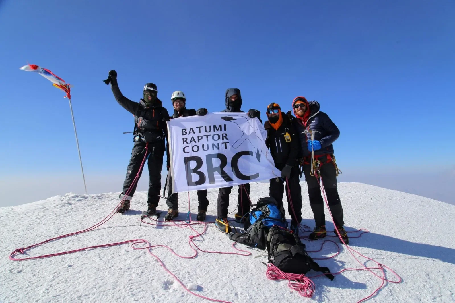 The BRC flag planted at the 5047m summit of Mount Kazbegi