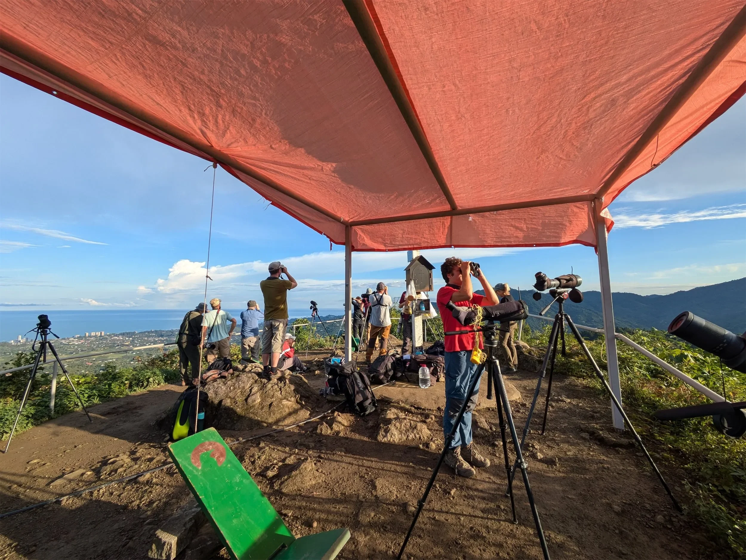 Station 2's bright red tarp stands out against the hillside